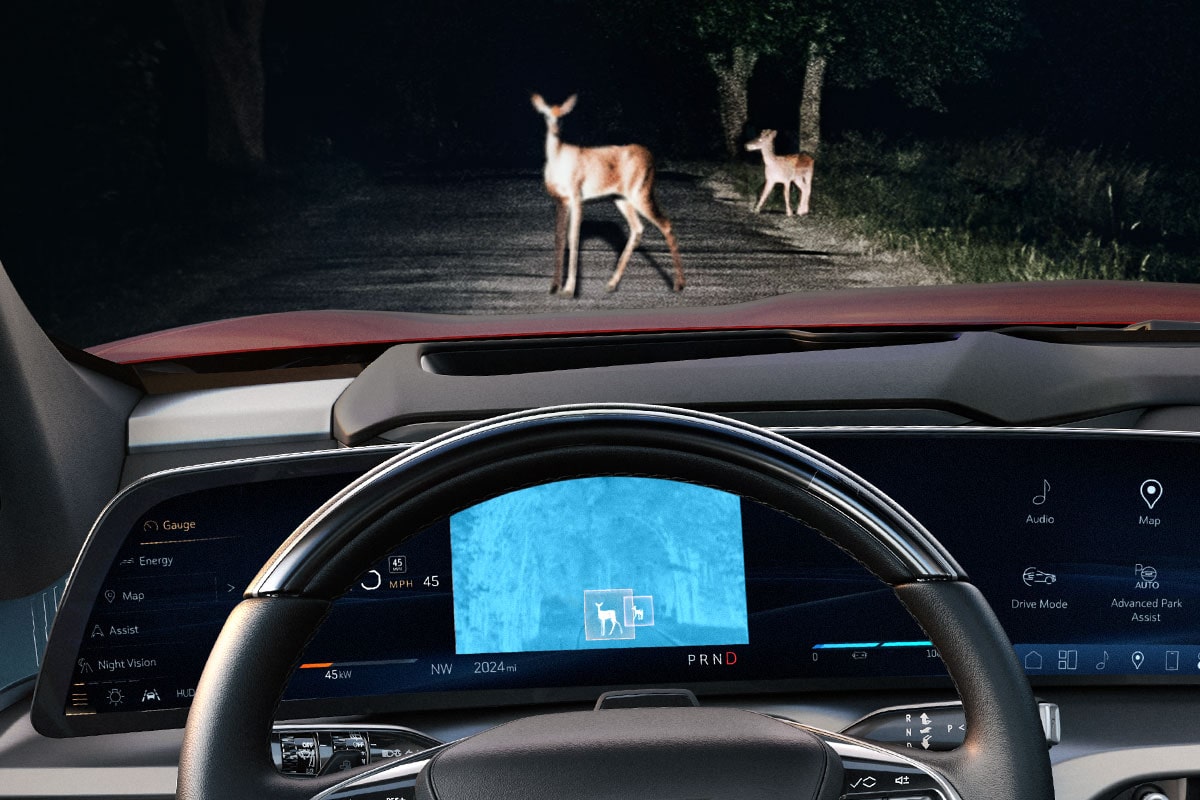 The 2027 VISTIQ Driver Screen Utilizing the Night Vision Feature Outlooking Two Deer Walking Across the Road