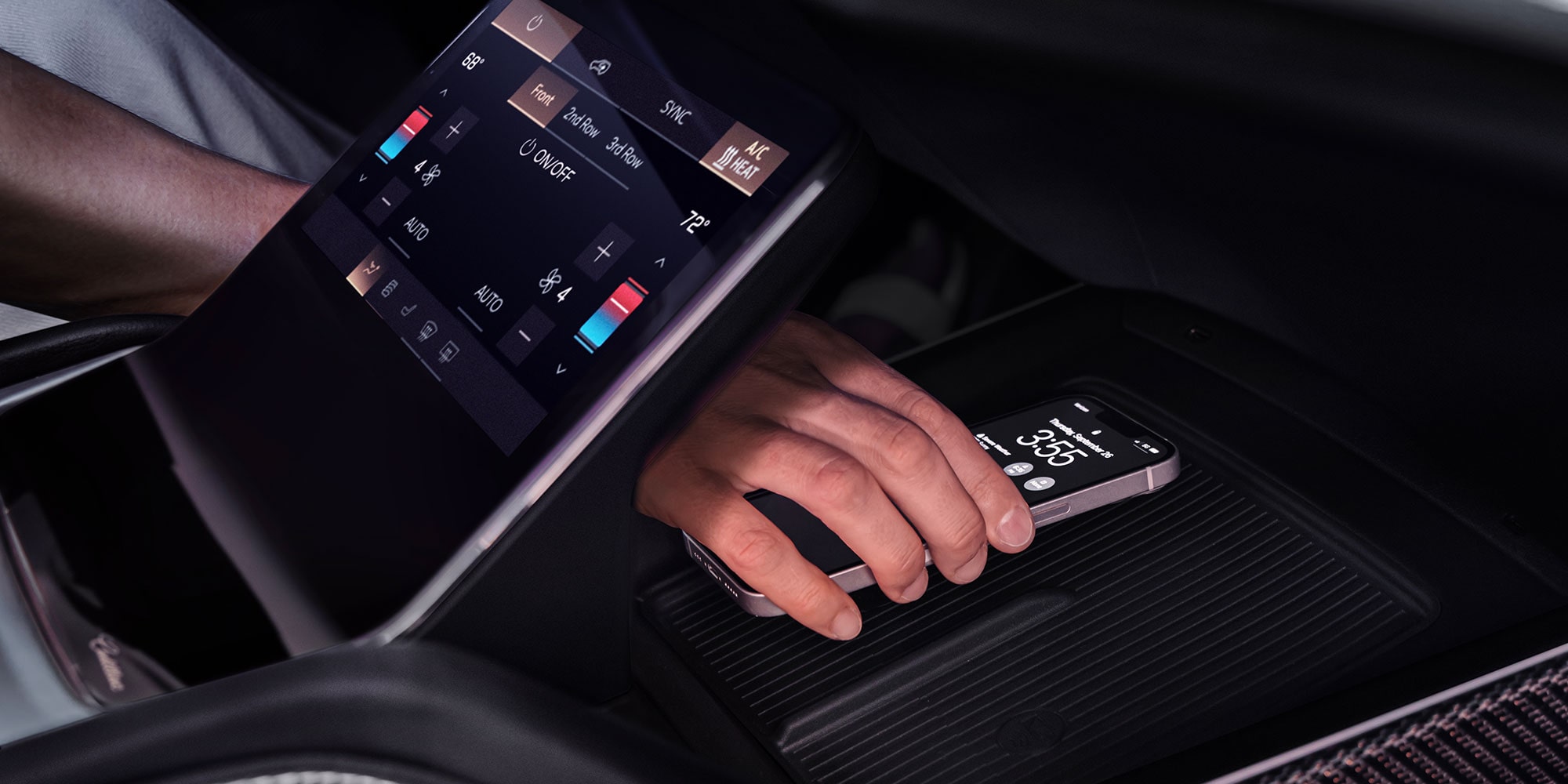Someone Putting a Phone on the Charging Platform in the 2027 VISTIQ's Middle Console