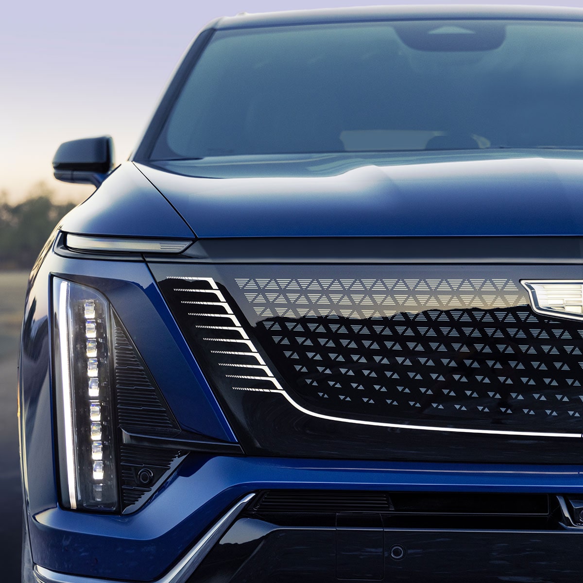 Close-up of the 2027 VISTIQ 3-row SUV Grille and Passenger Side Headlamp