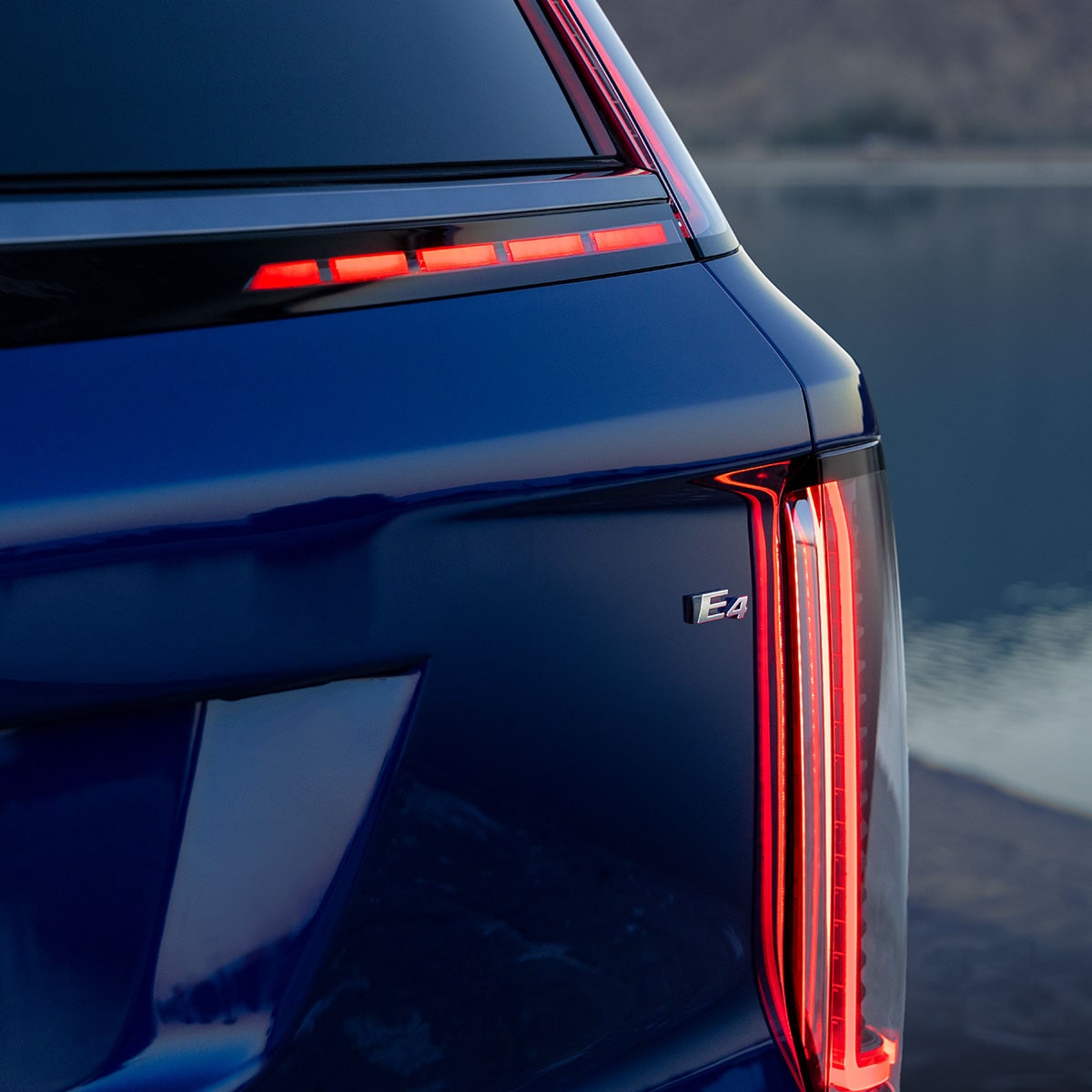 Close-Up of the a 2027 Blue Cadillac VISTIQ Showing the Taillight and the E4 Badge