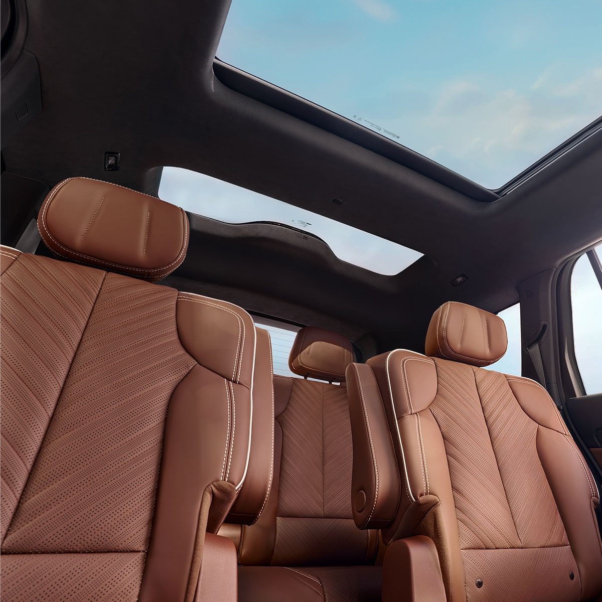 Floorboard View of the Cadillac VISTIQ's Two Brown Leather Back Rows and Dual Pane Sunroof