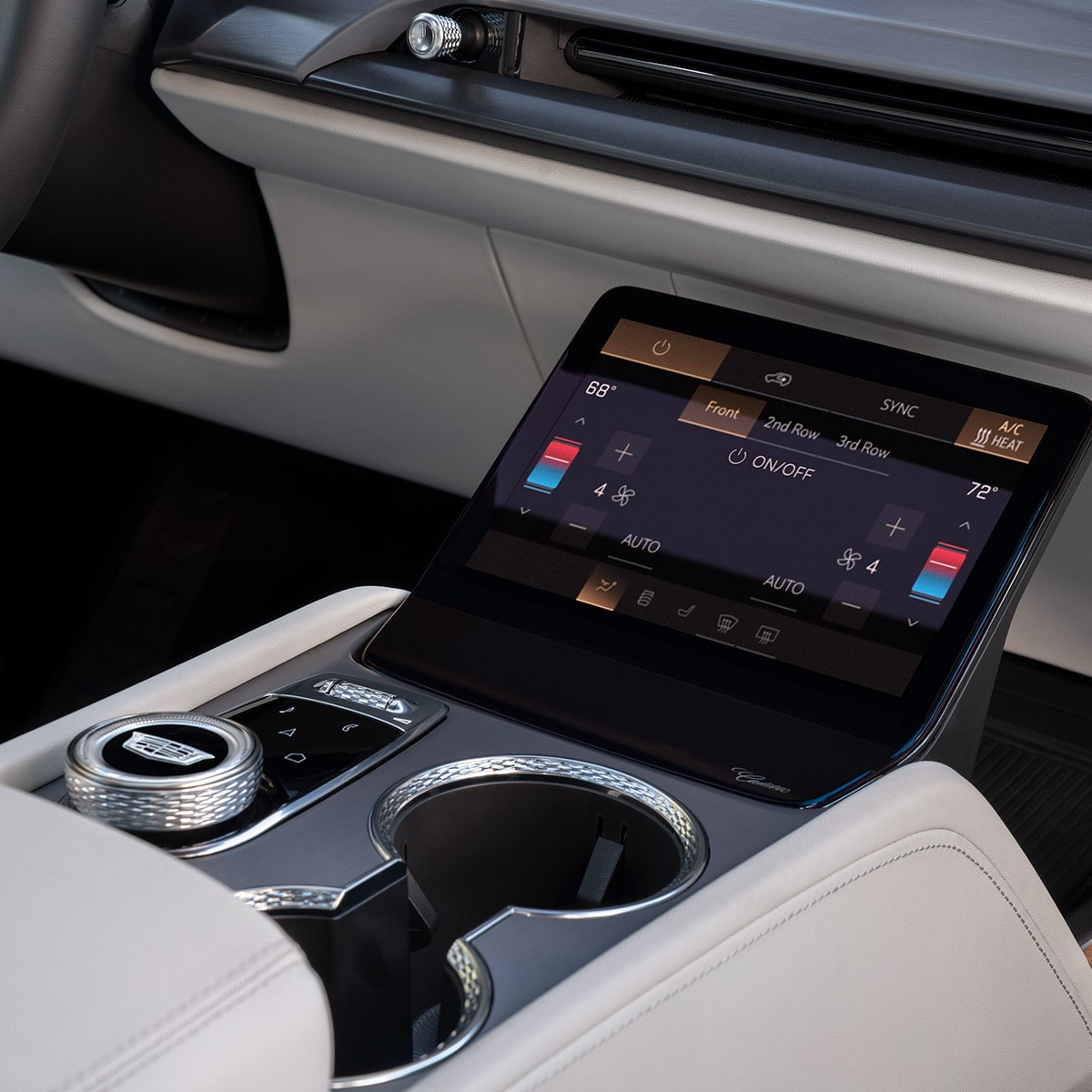 Close-up of the 2027 Cadillac VISTIQ Middle Console Including the Cup Holders, Gear Knob and Climate Control Screen