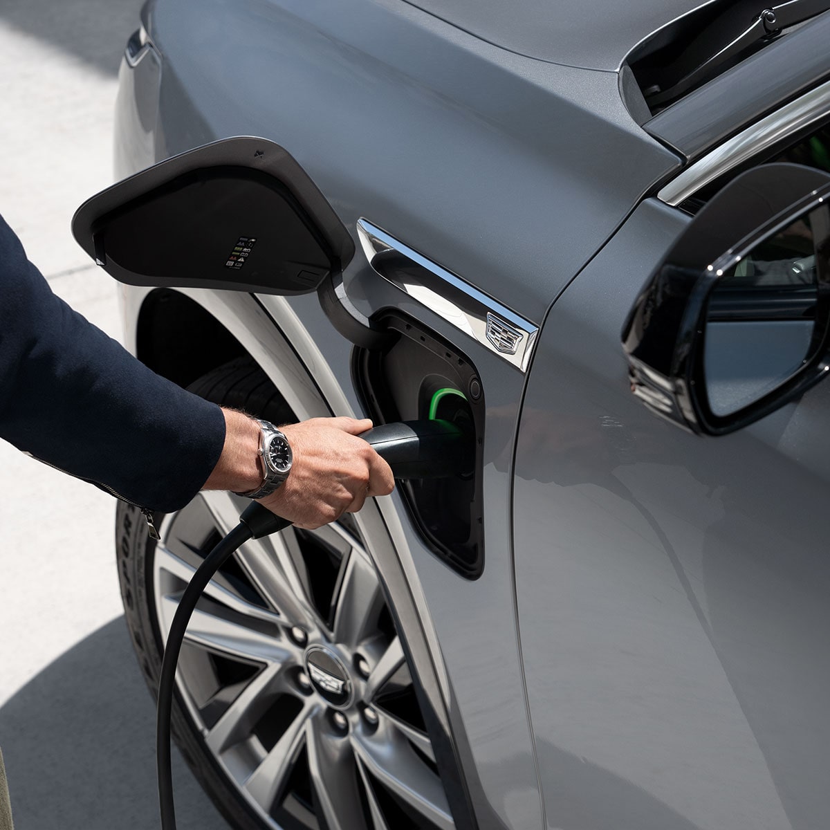 Close-up of Someone Inserting the EV Charger into a VISTIQ's Charging Port