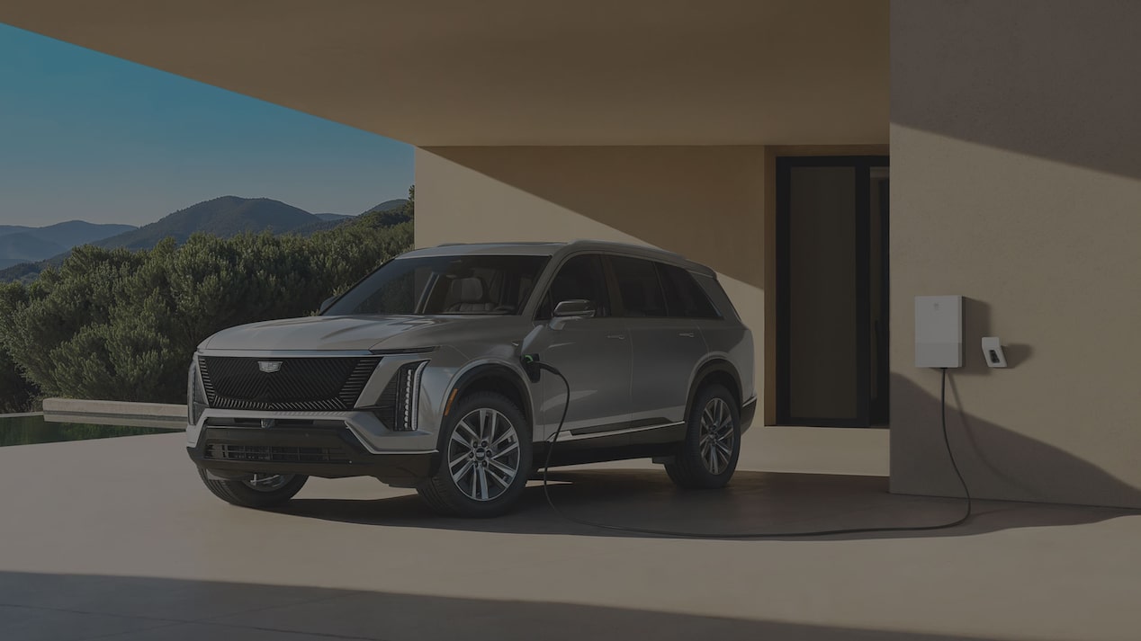 Three-quarter View of a Cadillac VISTIQ Parked and Charging at a Home Charger