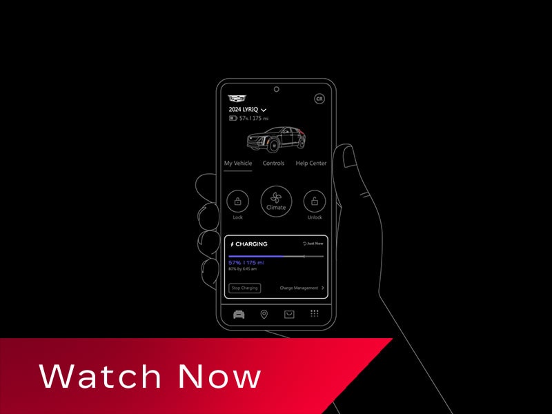 A Black and White Demonstration of Someone Holding a Phone Displaying the Managing Your EV Settings in the myCadillac Mobile App