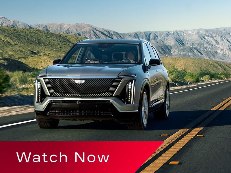 The 2027 Cadillac VISTIQ 3-row Electric SUV Driving Down a Road in the Mountains