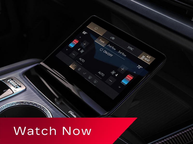 Close-up of the 2027 Cadillac VISTIQ Middle Console Including the Cup Holders, Gear Knob and Climate Control Screen