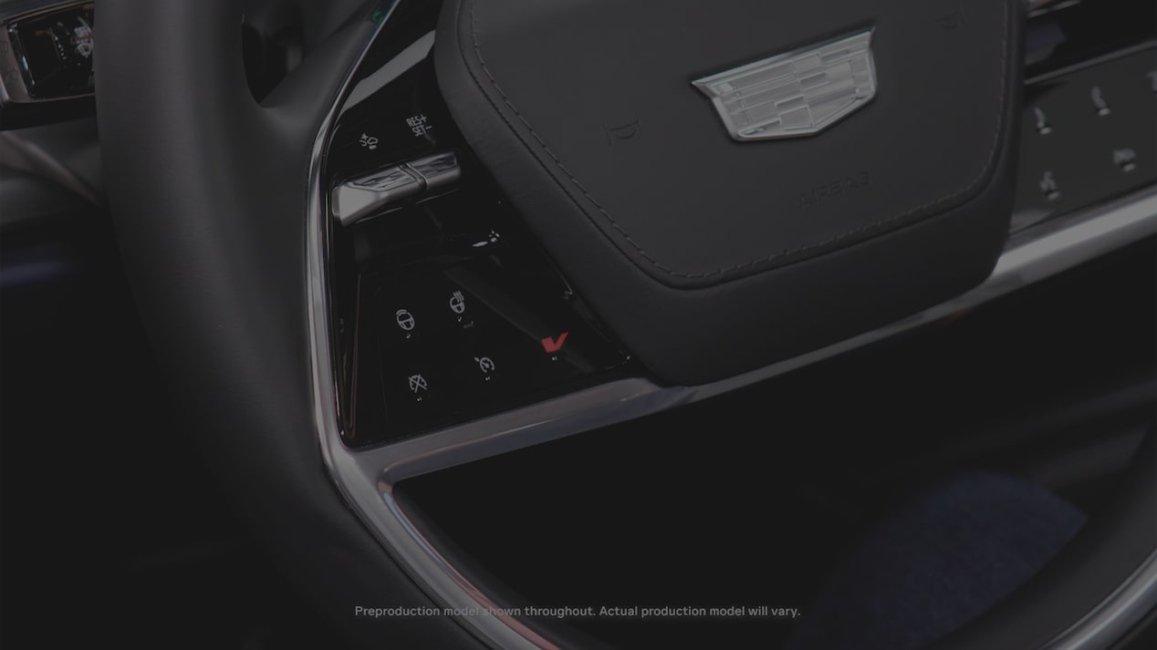 Close-up of the V Button on the 2027 Cadillac VISTIQ Steering Wheel