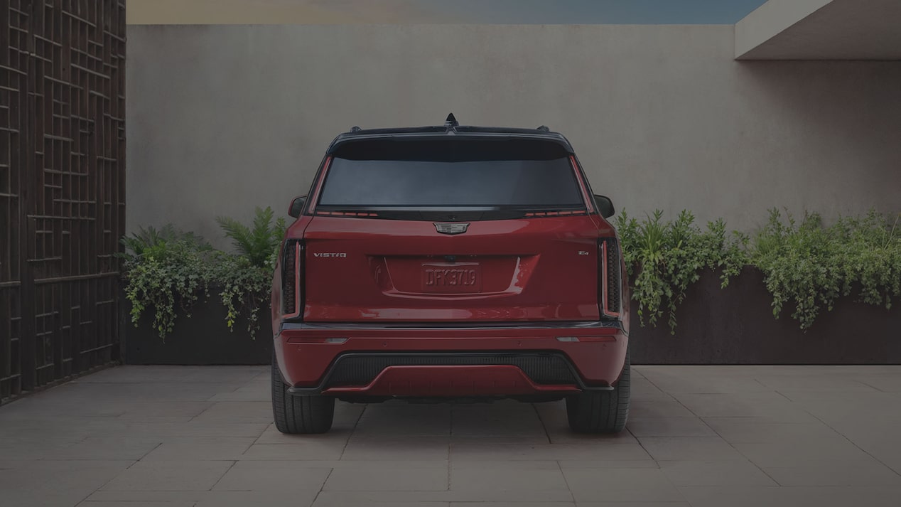 Rear View of a Red 2027 VISTIQ Parked on a Concrete Driveway