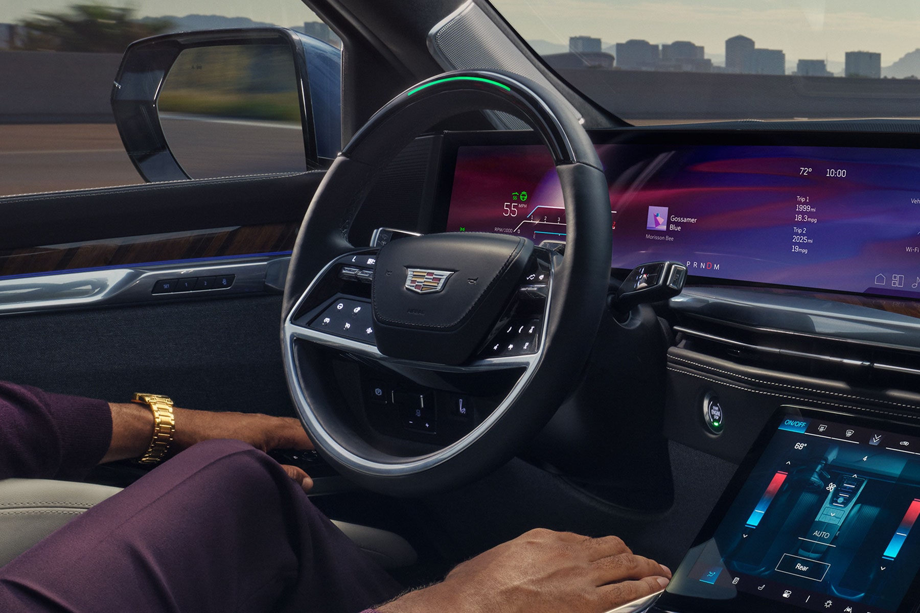 A Man Driving the 2027 Cadillac Escalade Hands-free Utilizing the Super Cruise Feature