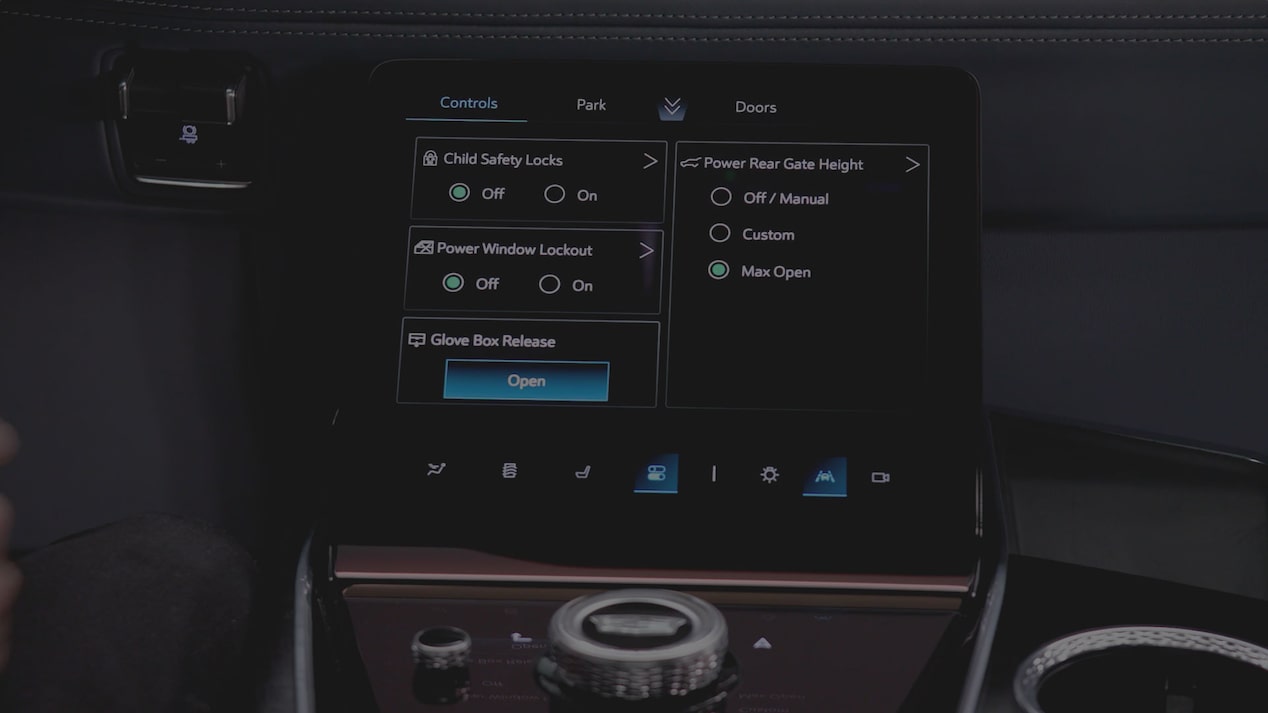 A 2027 Escalade Center Console Touchscreen Displaying Vehicle Access, Window Controls, and Power Liftgate Settings