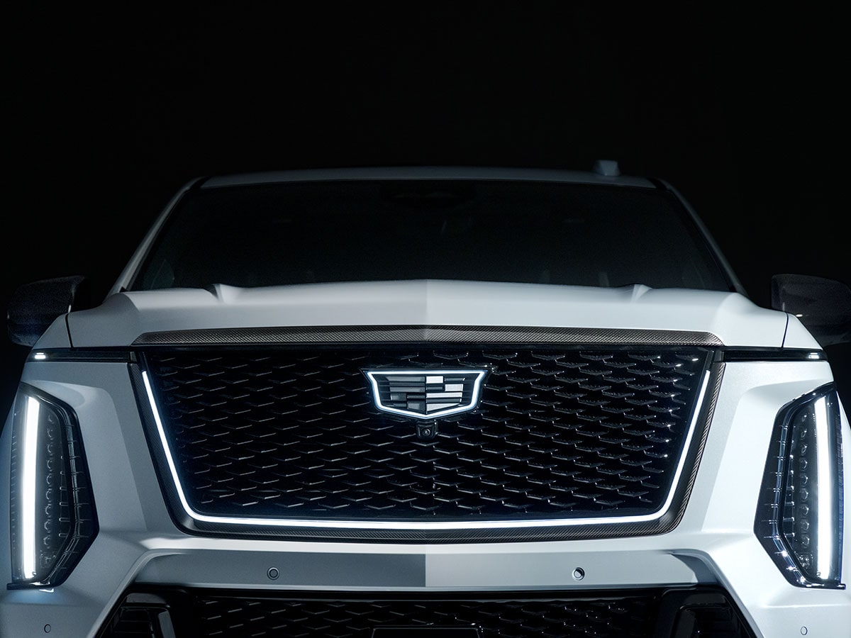 Close-up of the White Cadillac Escalade-V Grille and its Illuminated Cadillac Logo