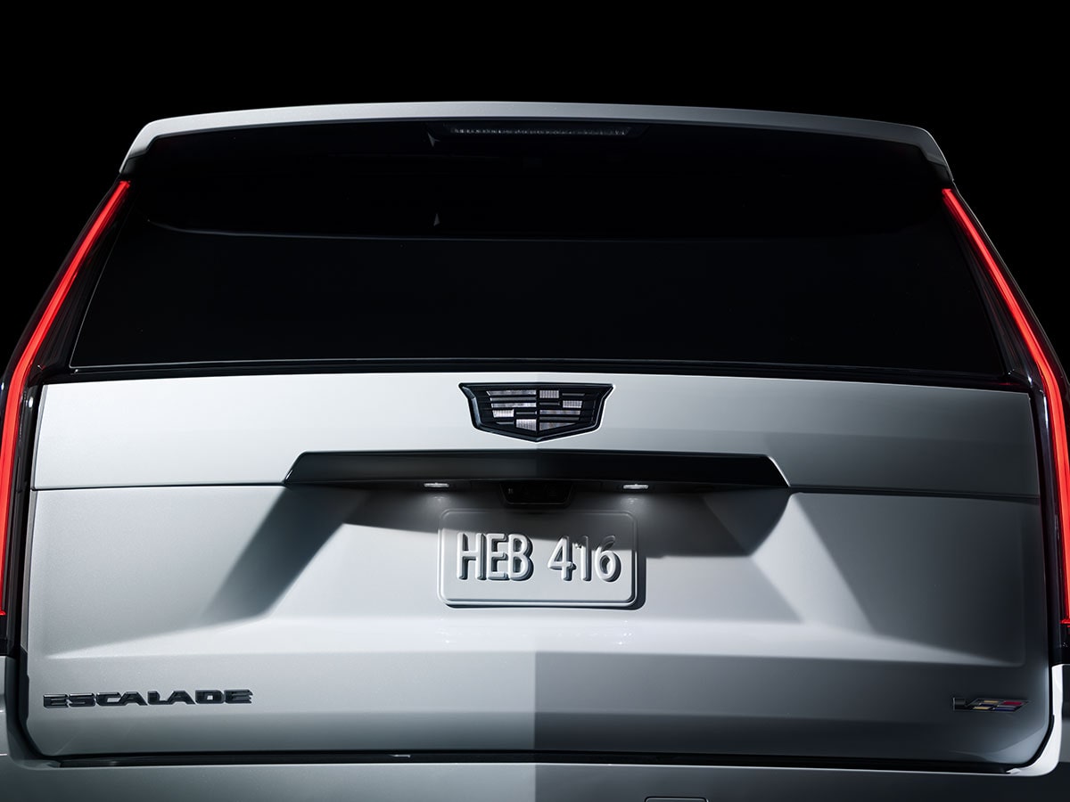 Rear View of a White Cadillac Escalade-V Collector Series Featuring Vertical LED Taillamps and an Illuminated License Plate Area