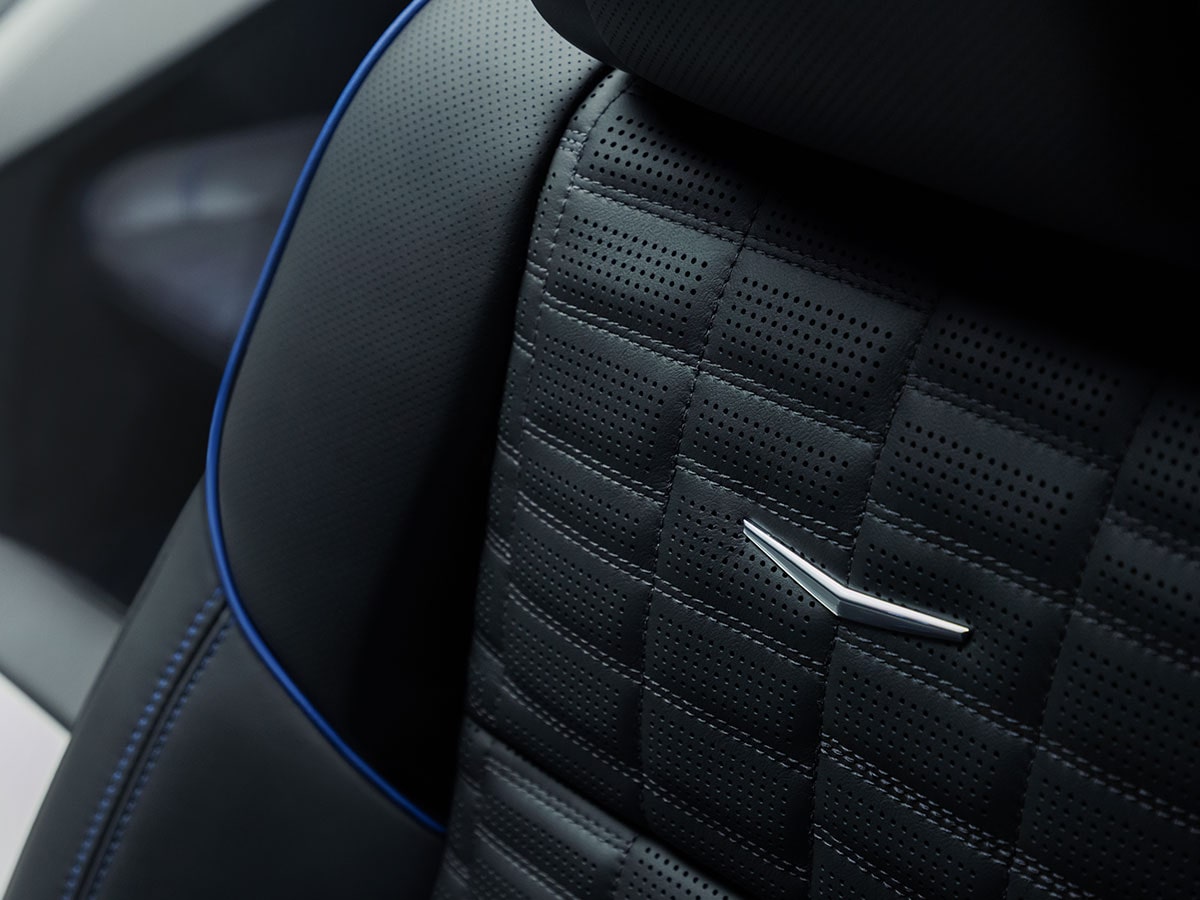 Close-Up of a Metallic V-Series Emblem on the Cadillac Escalade-V Collector Series Front Seat
