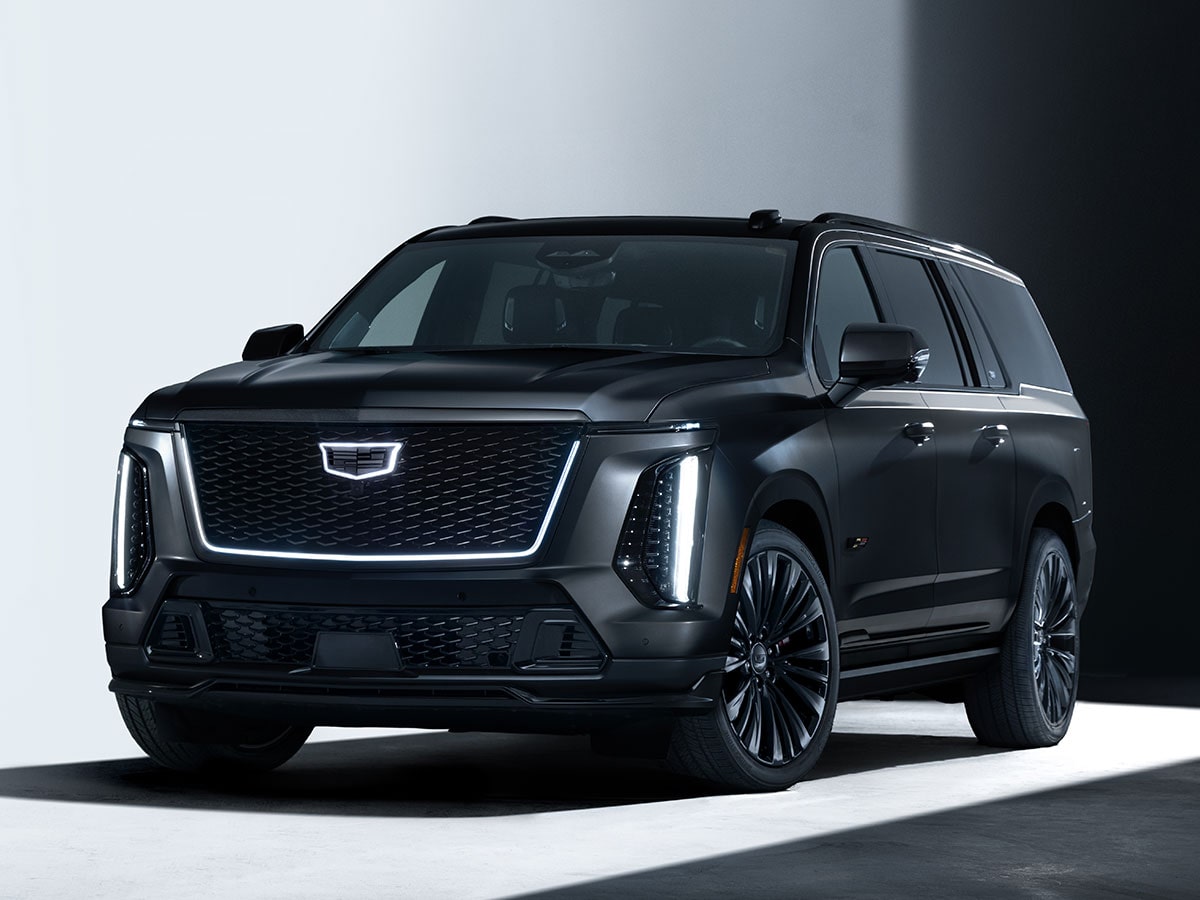 Three-quarter View of a Black Cadillac Escalade-V Collector Series Parked in a White Showroom