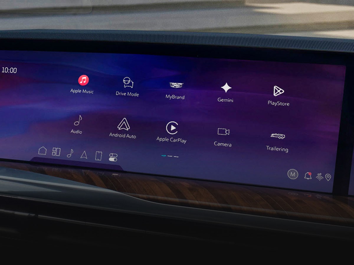 A 2027 Escalade Curved Display Screen Showing Integrated Apps, Connectivity Features, and Vehicle Controls