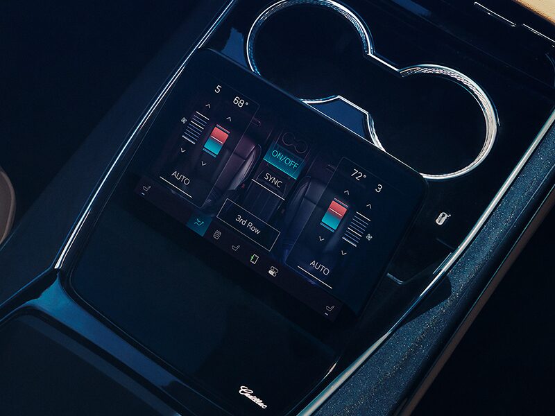 Interior View of the Display Touch Screen Next to the Cup Holders Showing Air Control