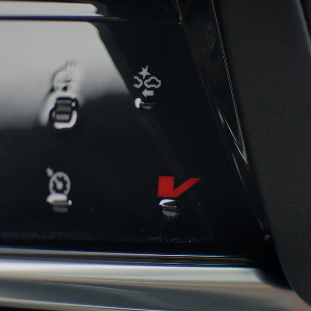 Close-Up of the V-Mode Button on the 2025 Escalade Steering Wheel