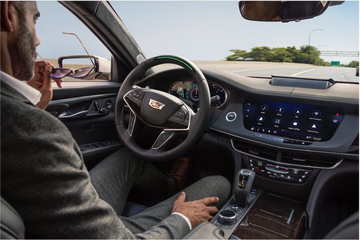 Man sitting in driver seat using Super Cruise