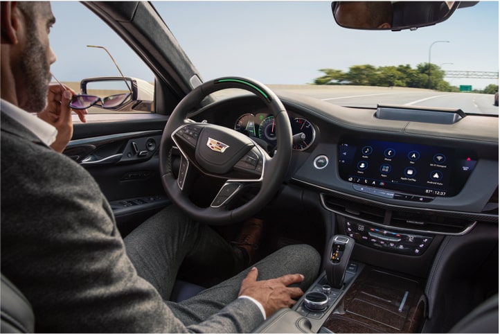 Man sitting in driver seat using Super Cruise