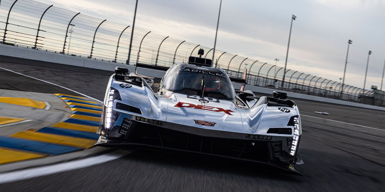 Three-quarters View of the Pink V-Series.R Racecar Driving on a Track