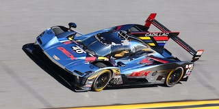 Three-quarter View of the Red V-Series.R Racecar Speeding on the Track