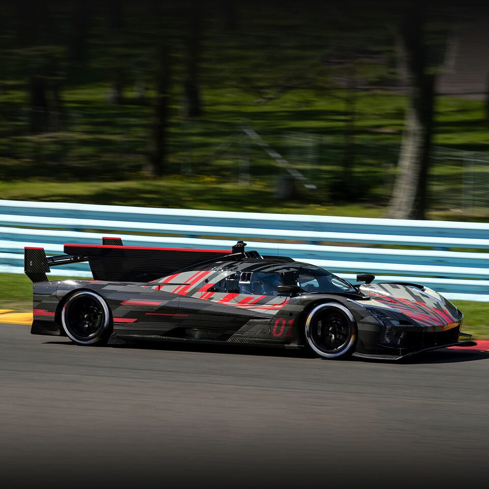 Side Profile View of The Cadillac lmdh-V Race Car Driving on Track