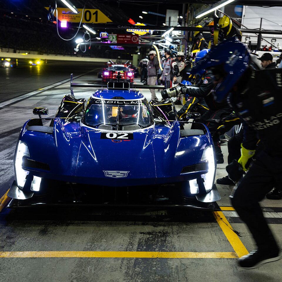 Side Profile View of The Cadillac V-Series.R Race Car Driving on Track