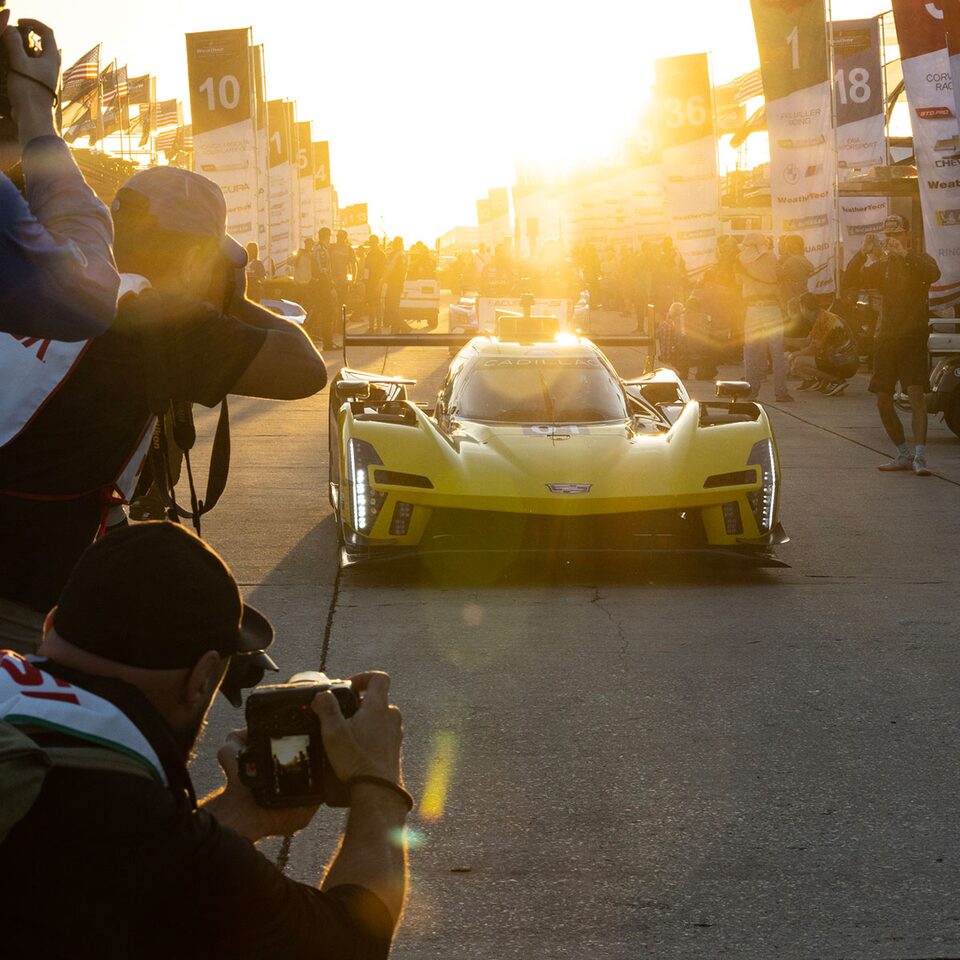 Photographers Swarm the Cadillac V-Series.R Prototype Race Car During Sunset