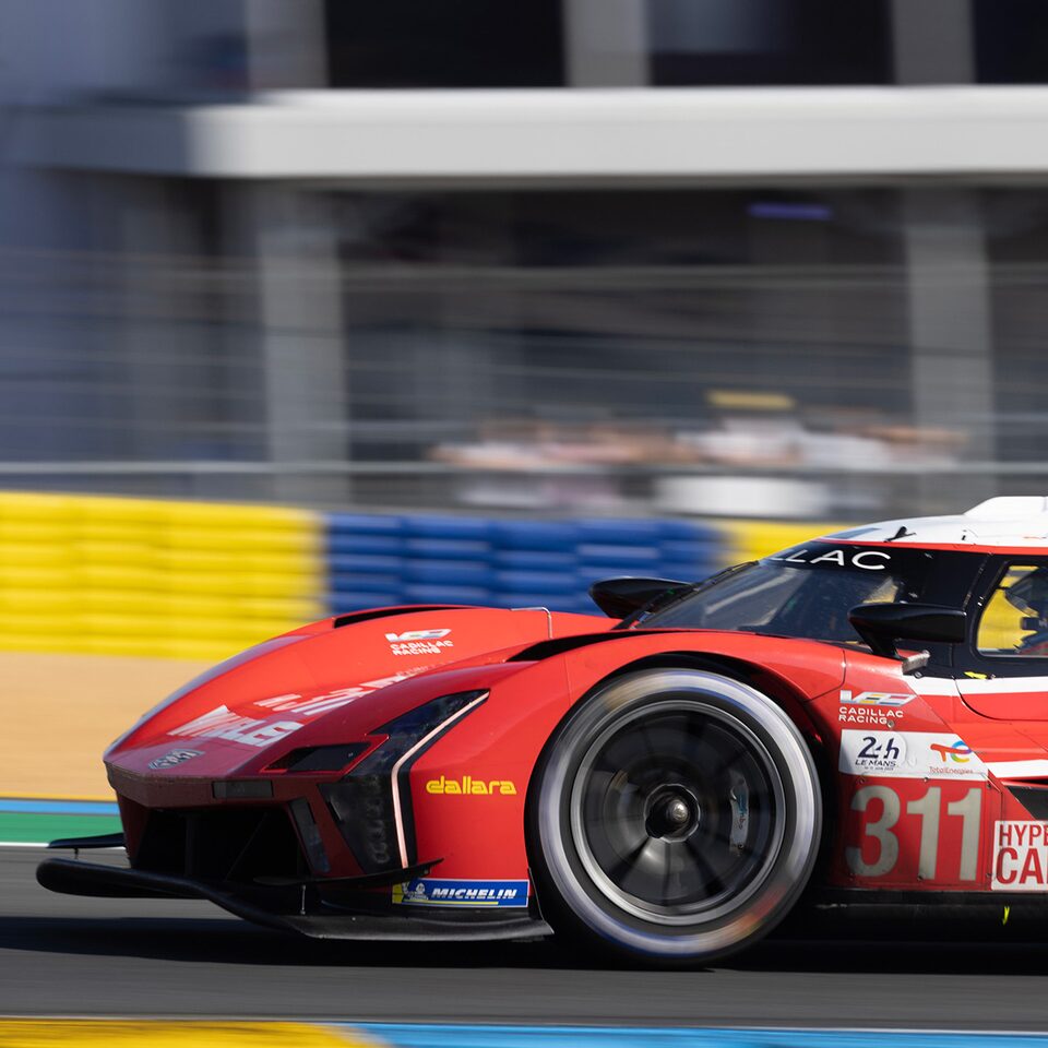 Red Cadillac V-Series.R Race Car Speeding On Track