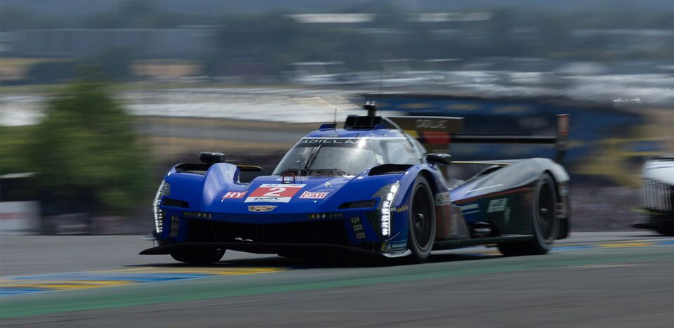 Cadillac Racing V-Series.R Zooming on Race Track