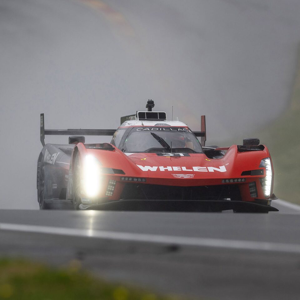 Cadillac V-Series.R Race Cars Driving On Track In The Rain