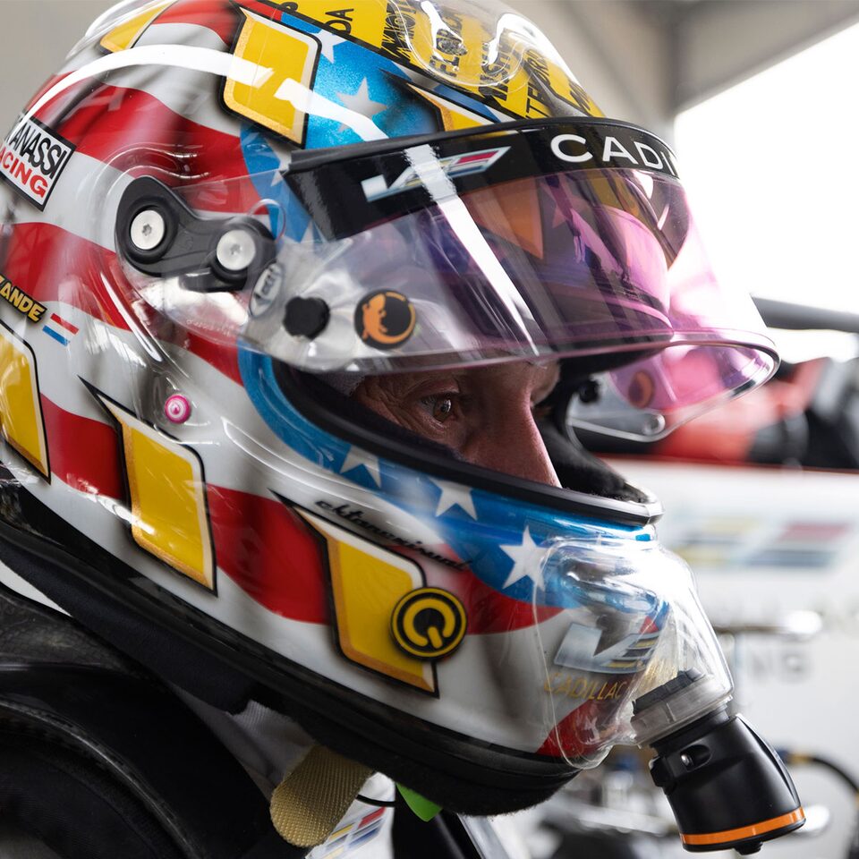 Cadillac Racing Driver With Helmet On About To Race