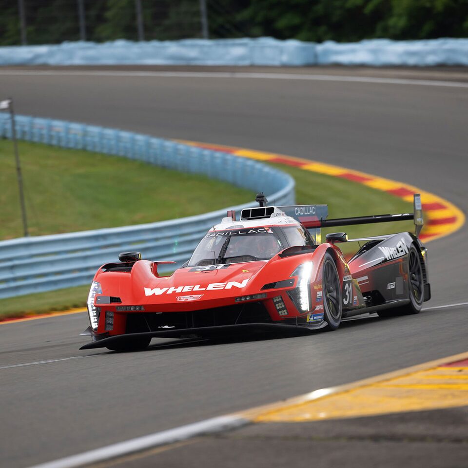 Cadillac V-Series.R Speeding Around Bend On Race Track