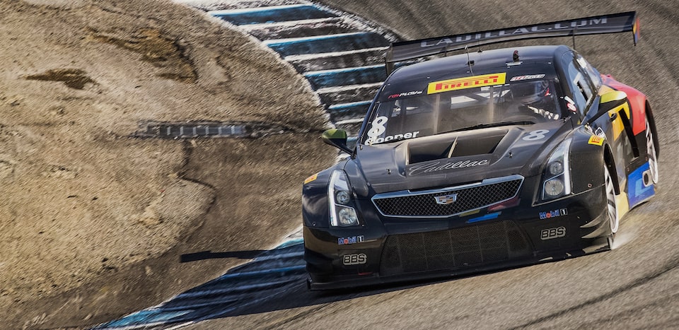 Cadillac Racing Heritage Race Car Fiercely Driving on Track