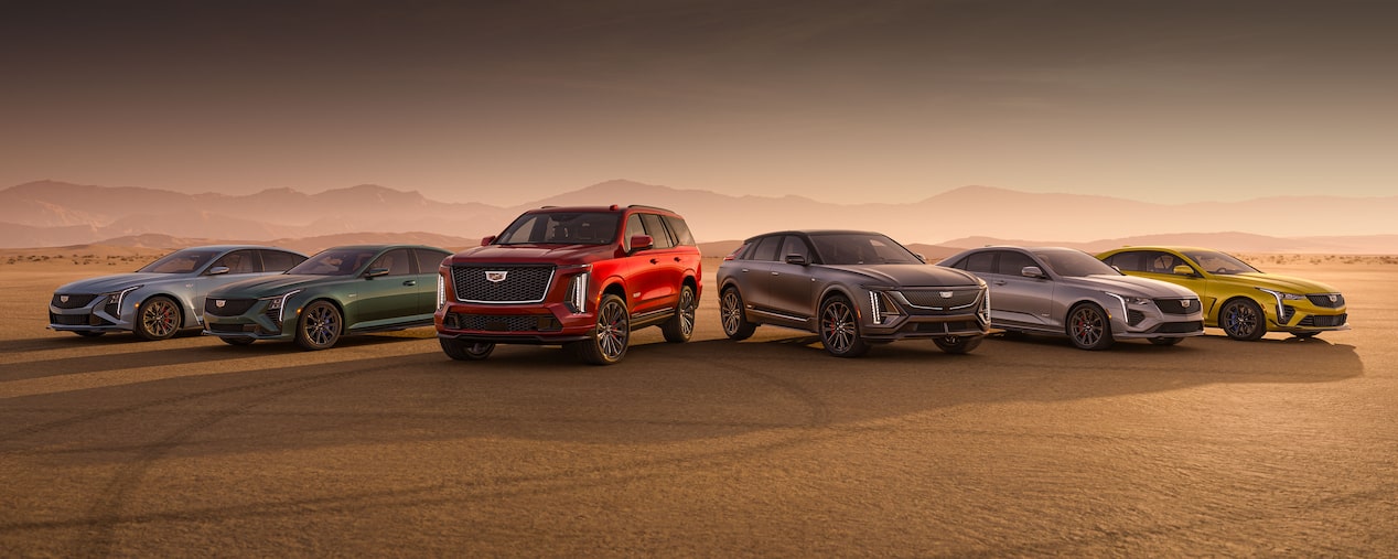 Cadillac's V-Series Performance Lineup on a Desert Field with Mountains in the Background