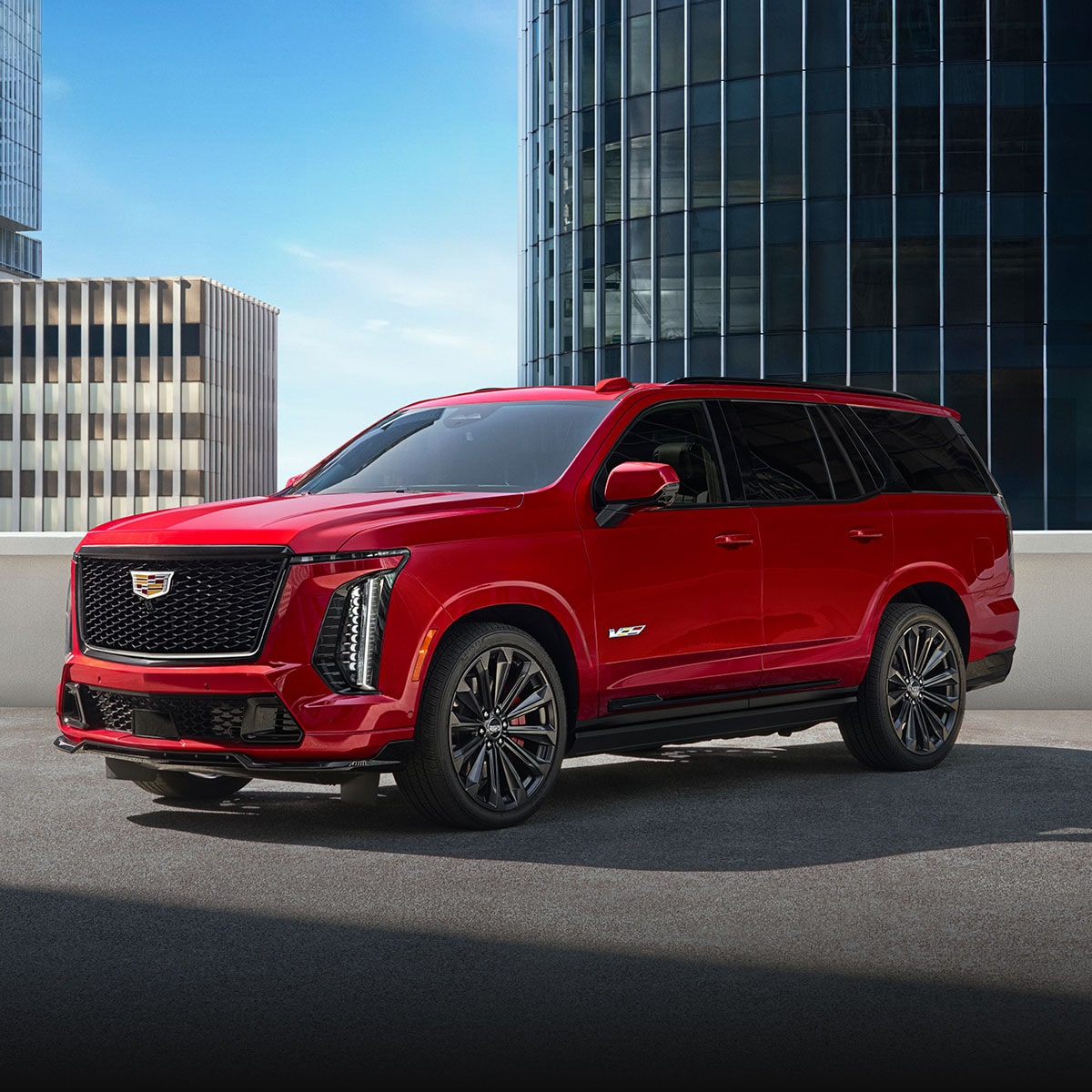 A Red Cadillac Escalade-V Parked in Front of a Modern Home.