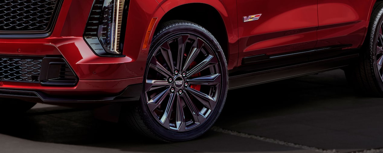 A Bottom View of a Red Escalade-V Displaying the Tire and V-Series Logo on the Driver Side