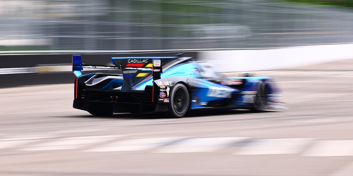 Bird's Eye View of the Blue Cadillac V-Series.R Race Car Driving on the Track