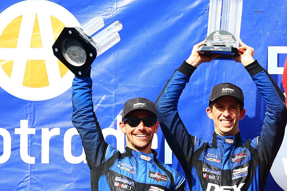 Close-up of the Cadillac Racing Team Members and Drivers Smiling and Talking on the Track