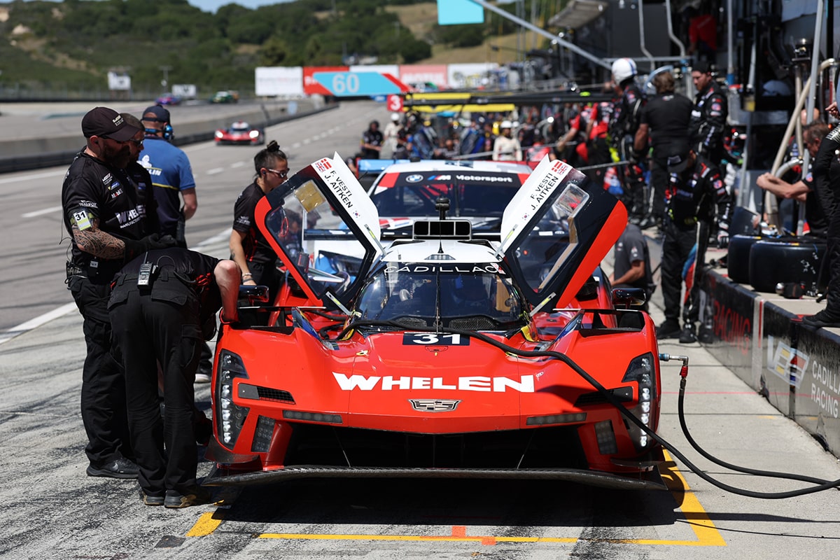 Side View of the Silver Cadillac V-Series.R Race Car Speeding on the Race Track