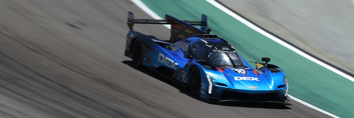 Side View of the Blue Cadillac V-Series.R Race Car Driving on the Track