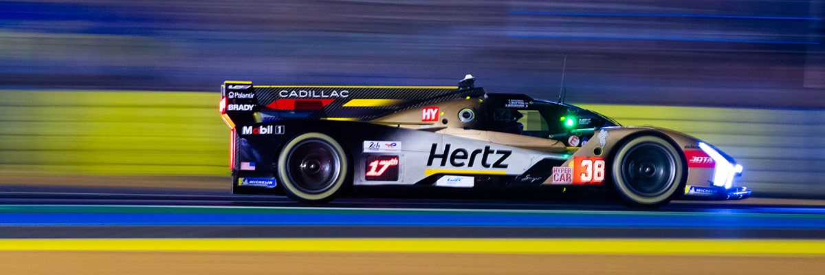 Side View of aCadillac V-Series.R Race Car Speeding Down the Track