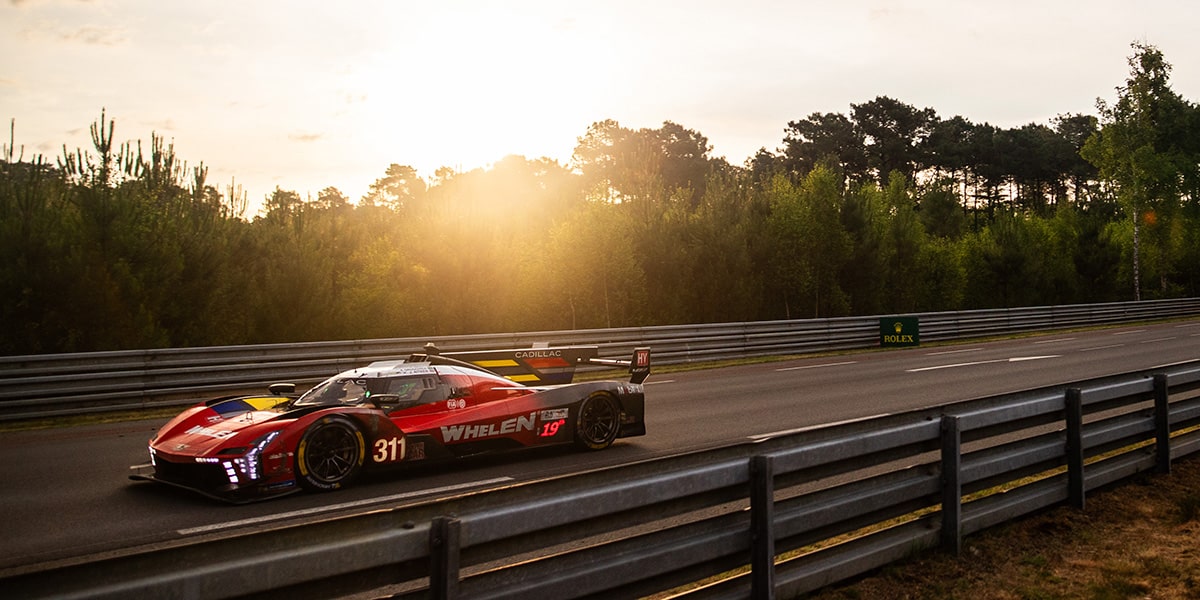 Drivers Three-Quarters View of the Red Cadillac V-Series.R Race Car Going Down a Track