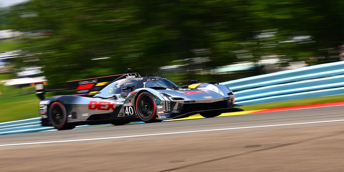 Drivers Three-Quarters View of the Red Cadillac V-Series.R Race Car Going Down a Track