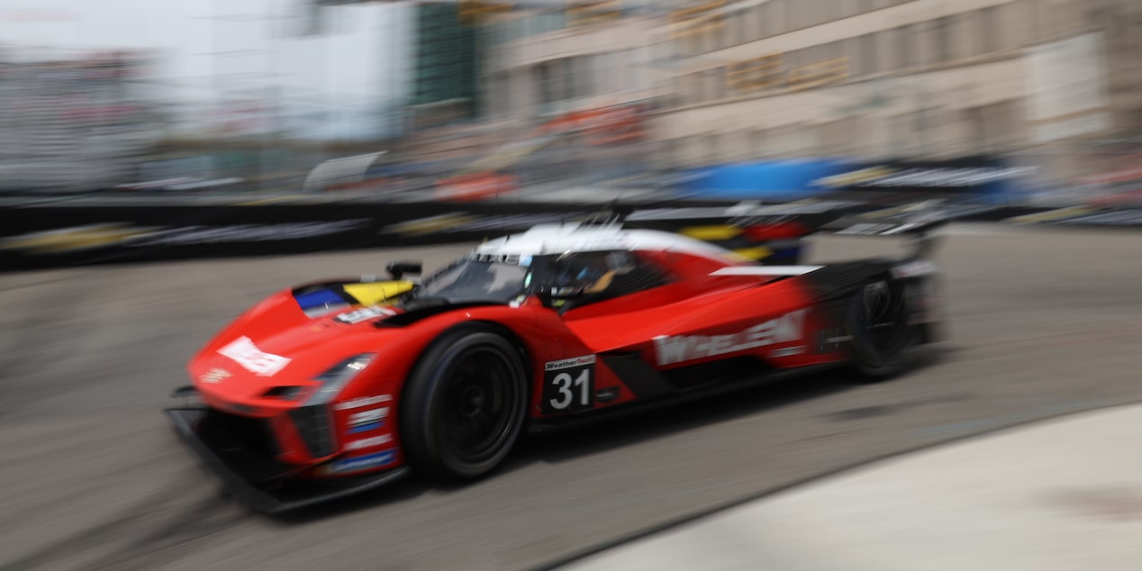 Front View of the Yellow V-Series.R Racecar with the Butterfly Doors Open