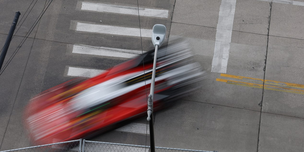 Bird's Eye View of the Red Cadillac V-Series.R Race Car Driving on the Track
