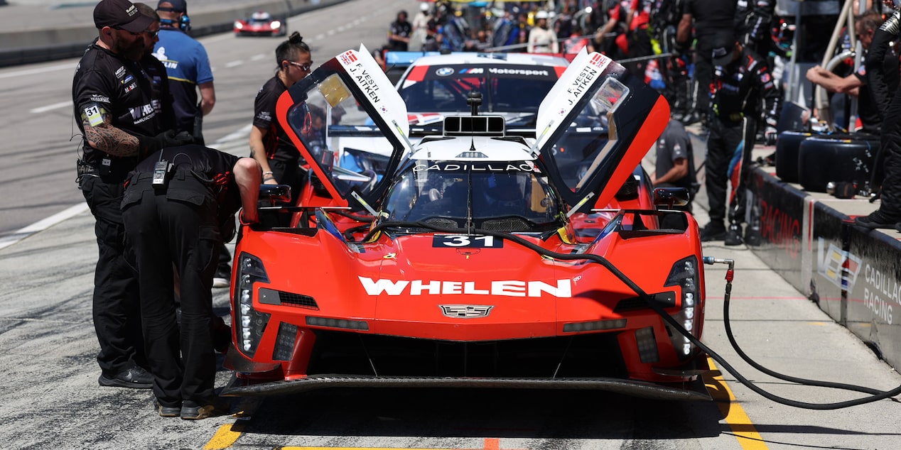 Front View of the Yellow V-Series.R Racecar with the Butterfly Doors Open