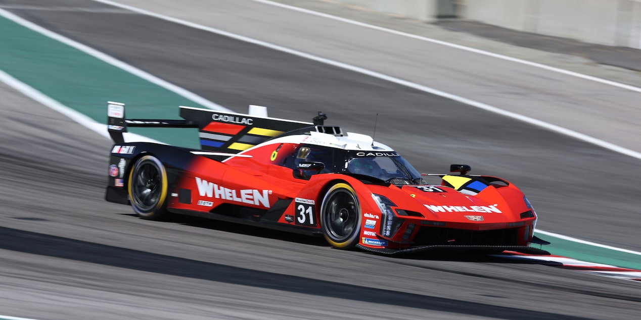Front View of the Yellow V-Series.R Racecar with the Butterfly Doors Open