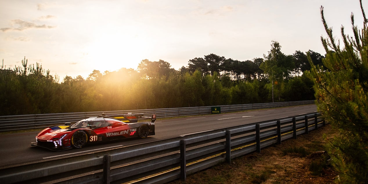 Drivers Three-Quarters View of the Red Cadillac V-Series.R Race Car Going Down a Track